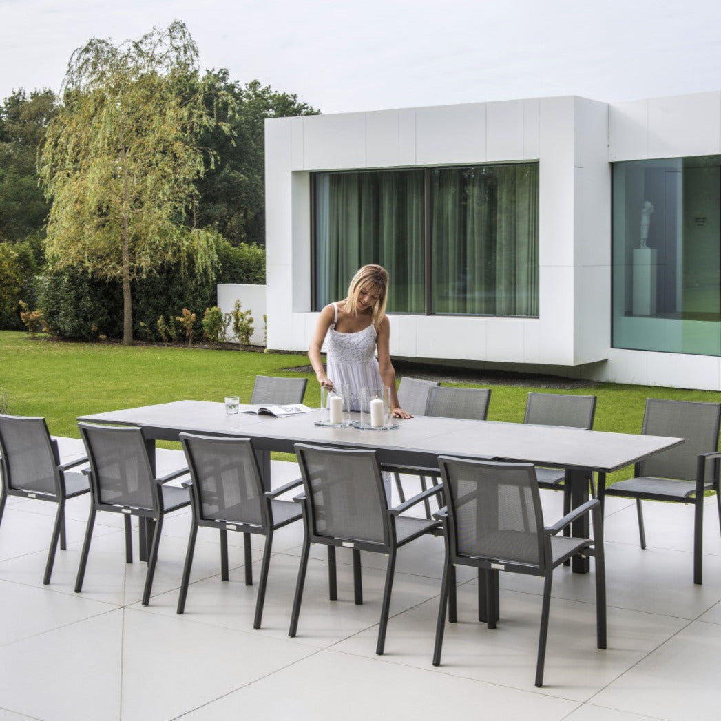 Livorno extendable garden table with all-ceramic table top 220-330x106 and Sevilla stacking chair in charcoal mat